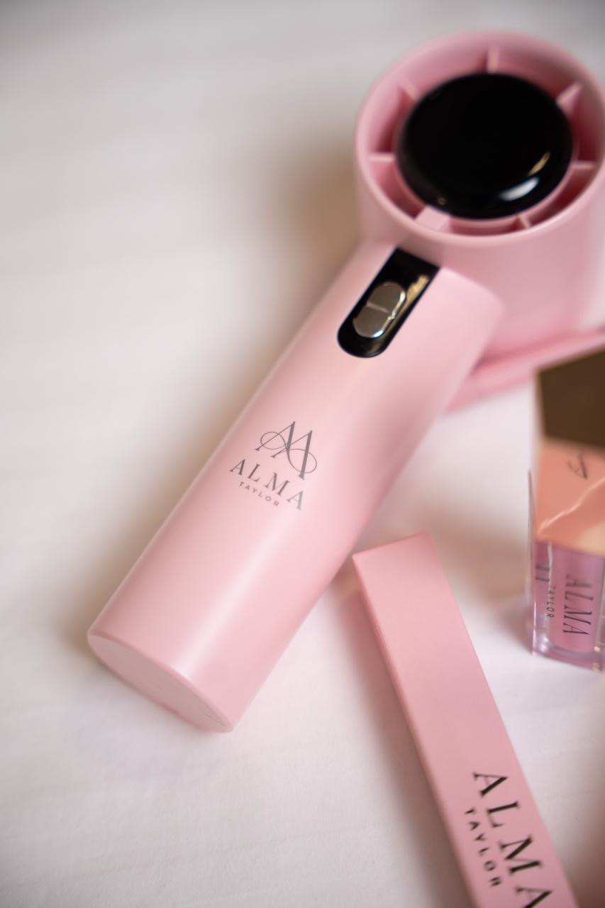 ALMA handheld fan in blush pink with the ALMA monogram